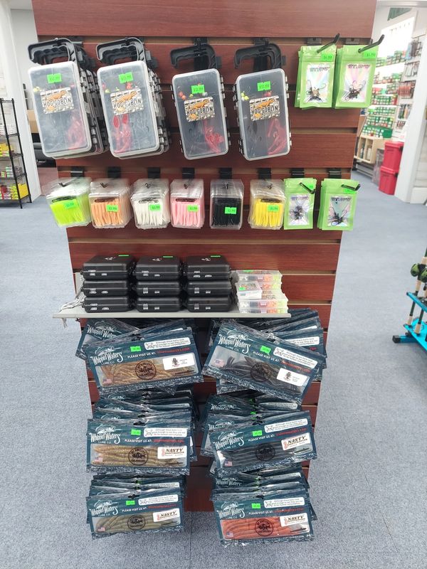 Fishing tackle and lure products displayed on a store shelf.