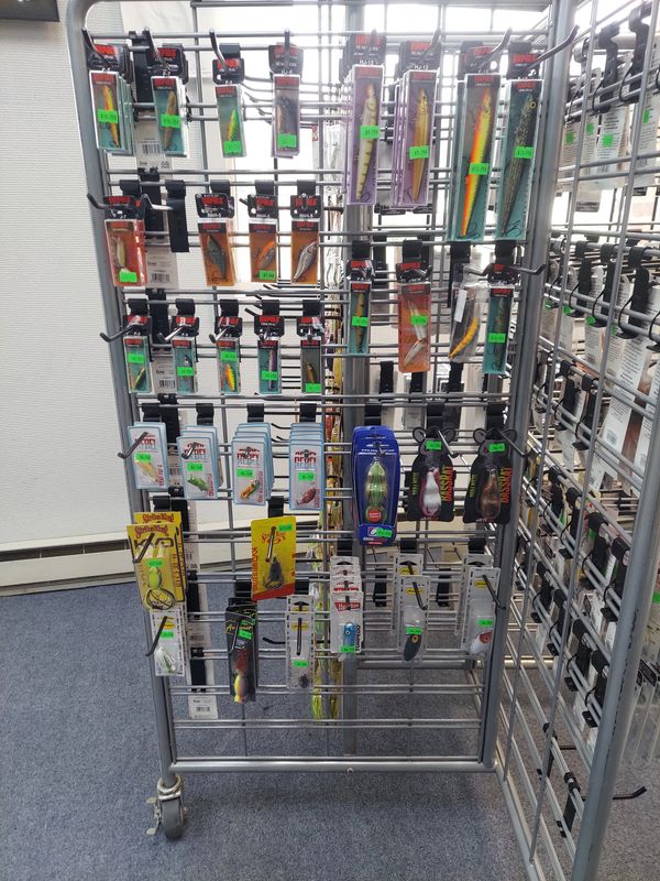 Display rack filled with various fishing lures and tackle.