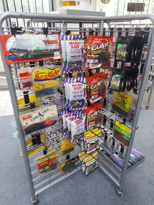 Display rack with various fishing baits and lures.