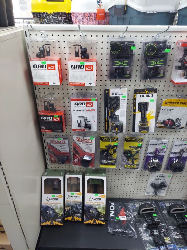 Archery accessories and parts on display in a store.