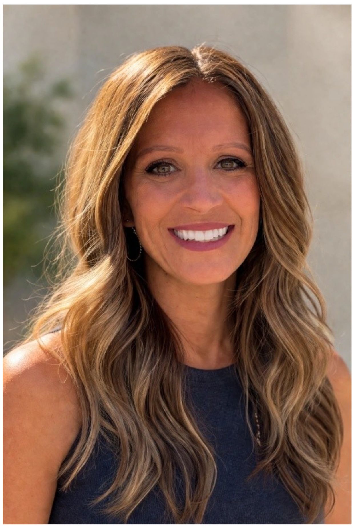 Happy woman smiling for photo Provider
