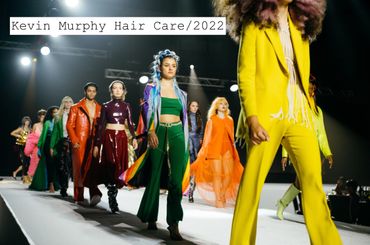 Models walk runway showcasing vibrant and diverse fashion styles at Kevin Murphy Hair Care 2022 event.
