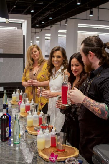 People enjoying a cocktail-making session.