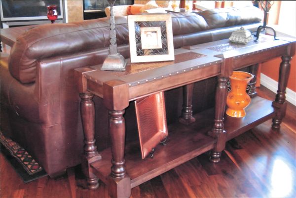 Custom sofa table with leather and metal top.