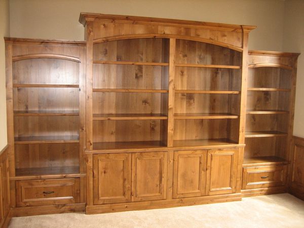 Custom built in bookshelves with matching wainscoting panels