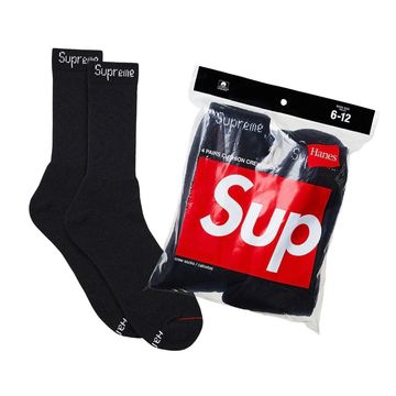 Black Supreme socks with packaging.