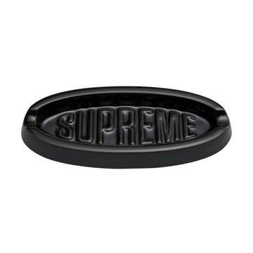 Black oval ashtray with SUPREME embossed.