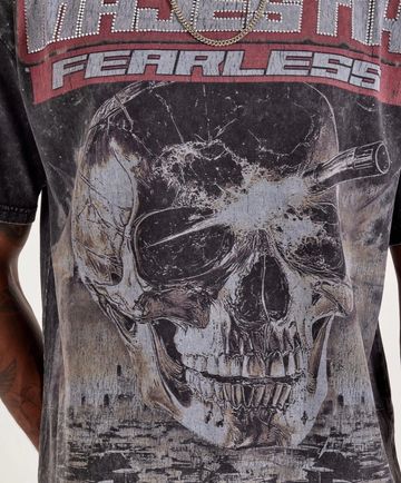 Graphic skull with nail in head and text fearless.