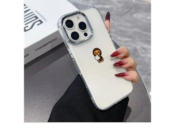 Hand holding a phone with a cute cartoon monkey case.