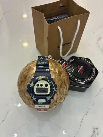 G-Shock watch with star pattern and packaging.