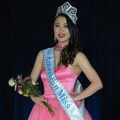 Stunning in pink is American Miss National Teen wearing her new AMP National Crown and Banner. 