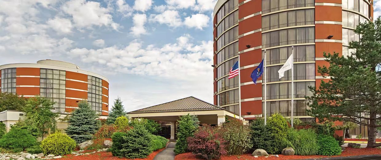 beautiful photo of the DoubleTree Hotel by HILTON in Portland Maine with blue sky and clouds 