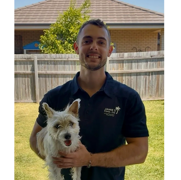 sunshine coast pool services technician holding jack russell