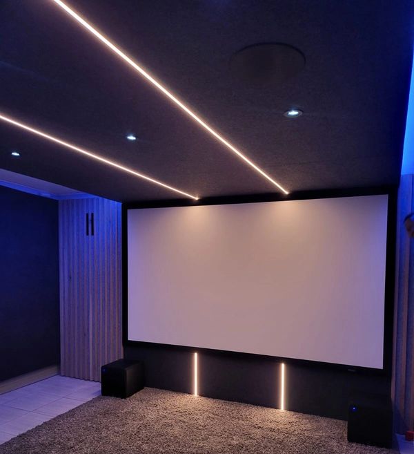 Modern home cinema with stylish acoustic wall panels, ensuring crystal-clear sound and zero distract