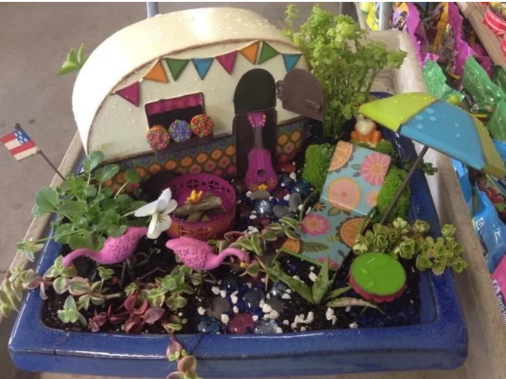 Fairy garden created with succulents and collectible miniatures