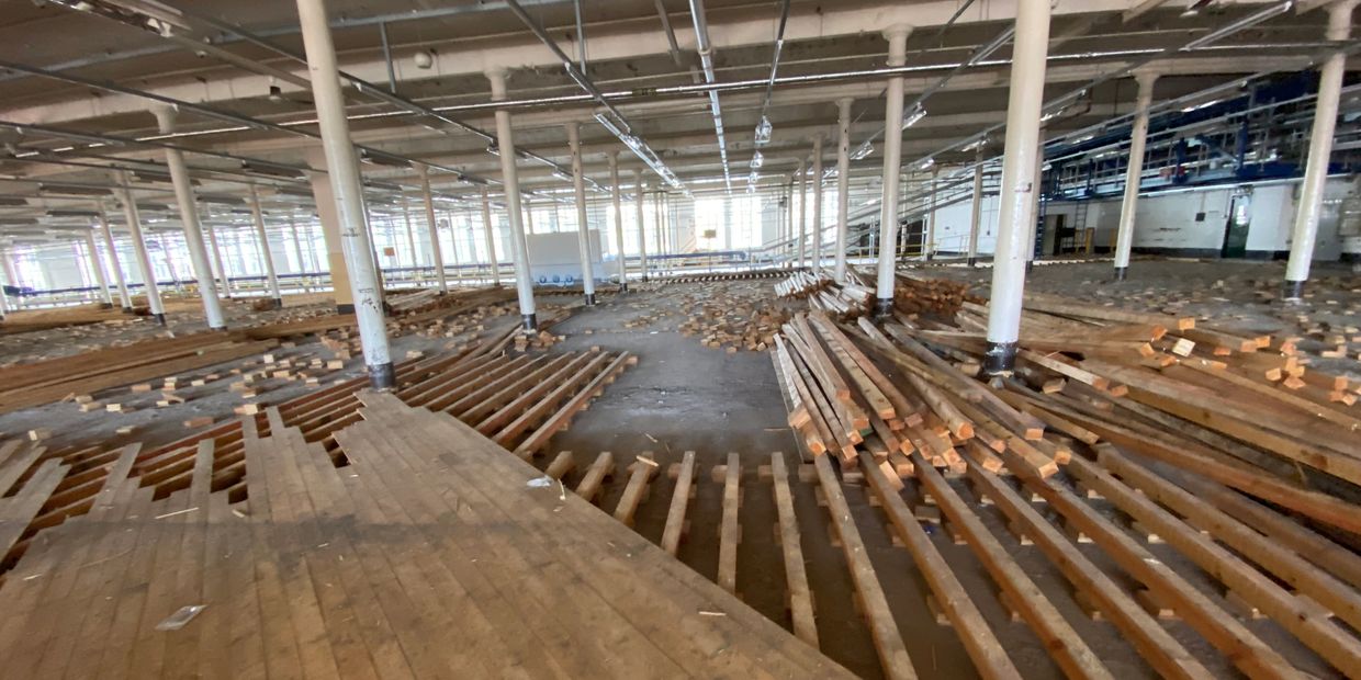 Flooring removal, reclaimed joist. Warehouse demolition