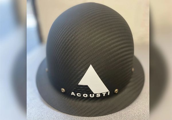 A hard hat with a text Acousti written on it