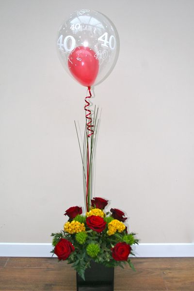 A gift arrangement - ready for a celebration with a gift balloon attached