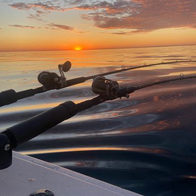 Sunset view on Lake Michigan from fishing boat. 