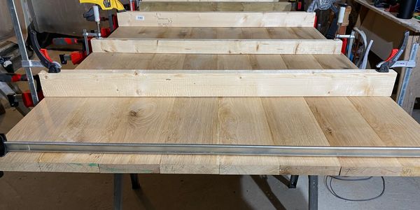 Wood panel clamped for gluing.