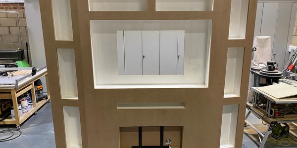 Wooden display or shelving unit in workshop.