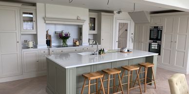 Modern kitchen with island and stools.