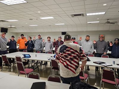 Members of ICWUC Local 132 are being sworn into the Union.