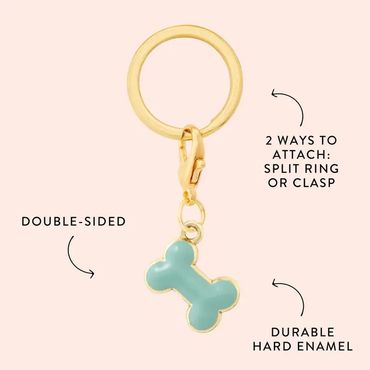 Gold keychain with a blue enamel bone charm, double-sided and attachable by split ring or clasp.
