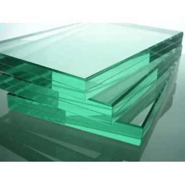 Stack of clear, green-tinted glass sheets.