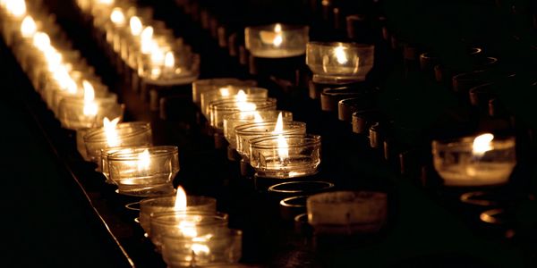 Hundreds of Candles illuminating a dark room