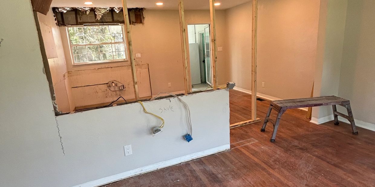 Interior demolition of a kitchen in Palm Coast, Florida, showing wall removal ready for remodel prep