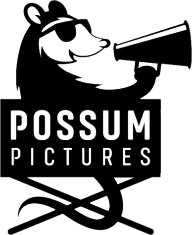 Black and white logo of a possum with sunglasses holding a megaphone.
