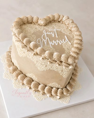 Heart-shaped cake with "Just Married" topper.