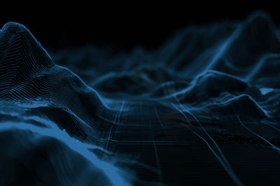 3D digital terrain model with blue grid lines and wave-like features.