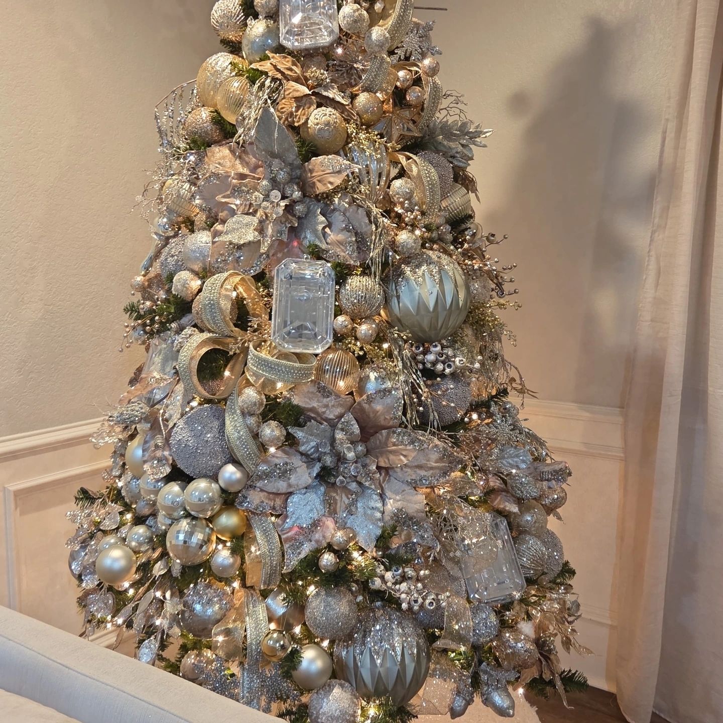 Elegant silver and gold decorated Christmas tree.