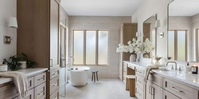 clean white and tan bathroom with custom white oak cabinetry