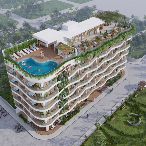 Modern hotel with rooftop pool and greenery-filled balconies.