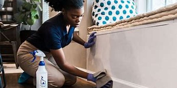  This woman cleaning a white baseboard we will try I best to get everything.