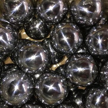 Close up mage of black color balls with some sparkling lights