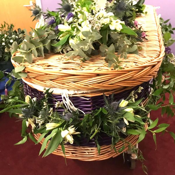 Wicker casket foliage and flower garland