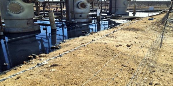 Oil spill in containment area which can lead to ground saturation, contamination, fines, and profit.