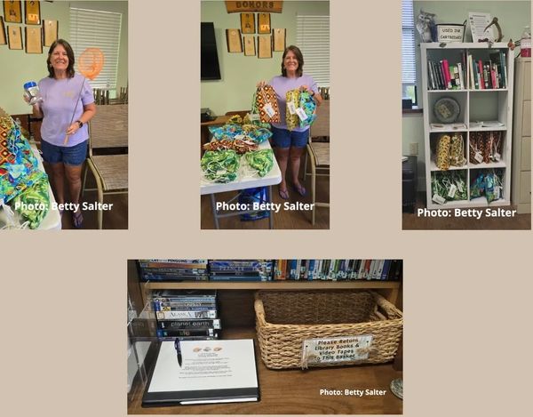 Mary holding up Exploration Kits and location on shelves.