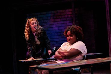 Emma as Muareen in Rent at Blackfriars Theater 
