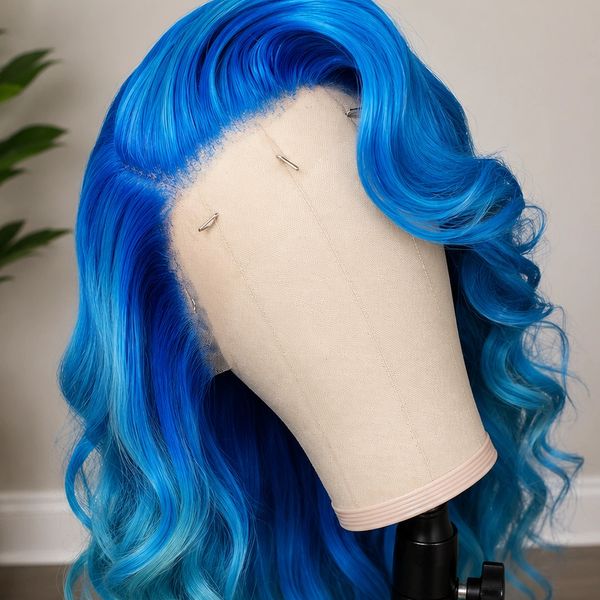 Vibrant blue wavy wig displayed on a mannequin head.