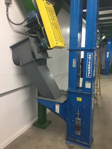 Industrial elevator machinery with safety covers.
