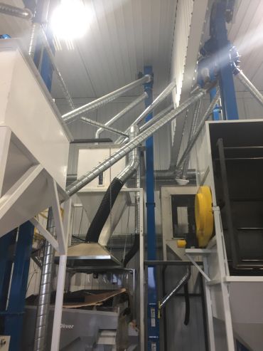 Industrial ventilation and duct system inside a factory.