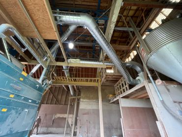 Industrial interior with pipes and metal structures.