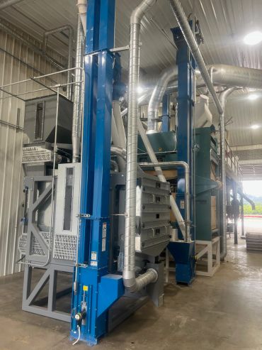 Industrial machinery with blue and silver pipes.