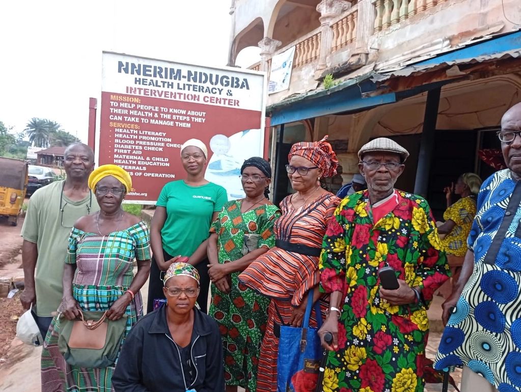 Group of people posing in front of a health literacy center.