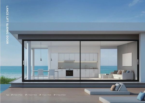 Modern home with large sliding glass doors overlooking the ocean.
